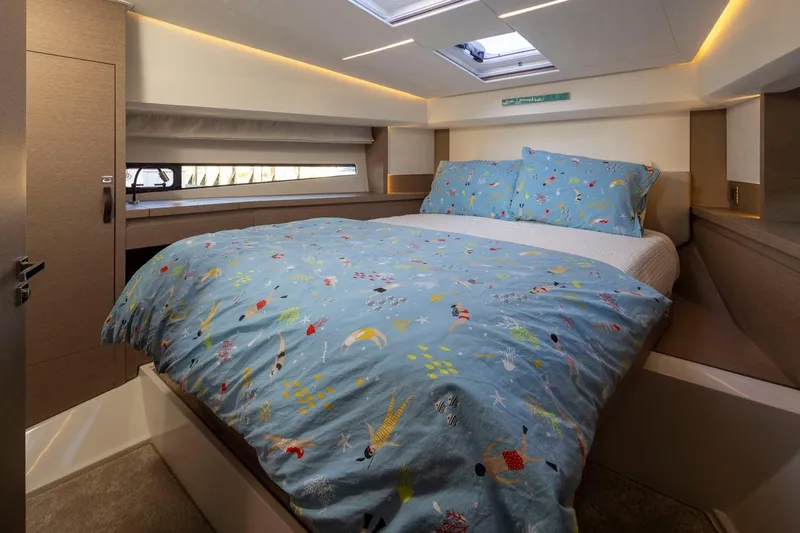 Four At Sea Yacht Photos Pics Luxurious cabin interior of 2019 Prestige 460 yacht with colorful bedding and modern design.