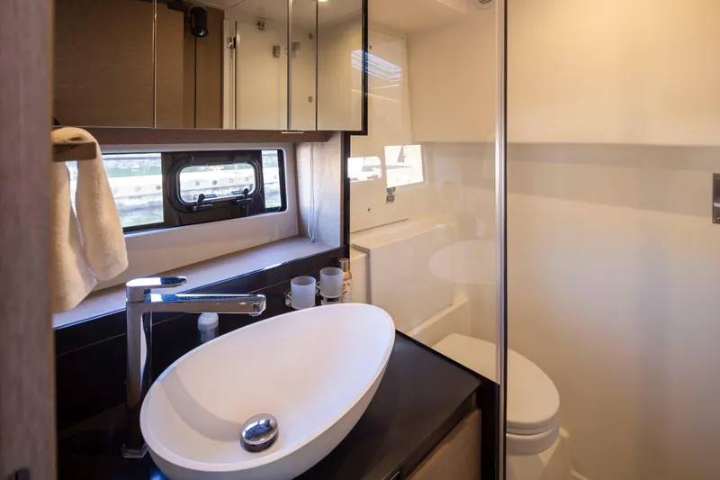 Four At Sea Yacht Photos Pics Luxurious bathroom interior of 2019 Prestige 460 yacht with modern fixtures.