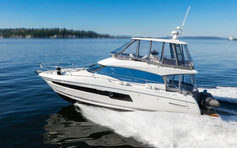 Four At Sea Yacht Photos Pics 2019 Prestige 460 yacht cruising on calm waters under clear blue skies.