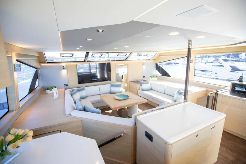  Yacht Photos Pics Luxurious interior of 2023 Aquila 54 Yacht with modern seating and large windows.