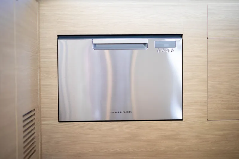  Yacht Photos Pics Built-in Fisher & Paykel dishwasher on 2023 Aquila 54 Yacht, sleek stainless steel design.