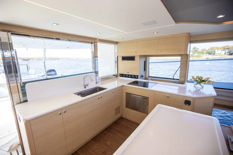  Yacht Photos Pics Modern kitchen interior of 2023 Aquila 54 Yacht with sleek design and waterfront view.