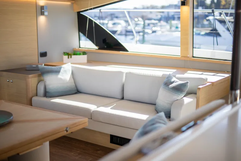  Yacht Photos Pics Luxurious interior of 2023 Aquila 54 Yacht with elegant sofa and modern decor.