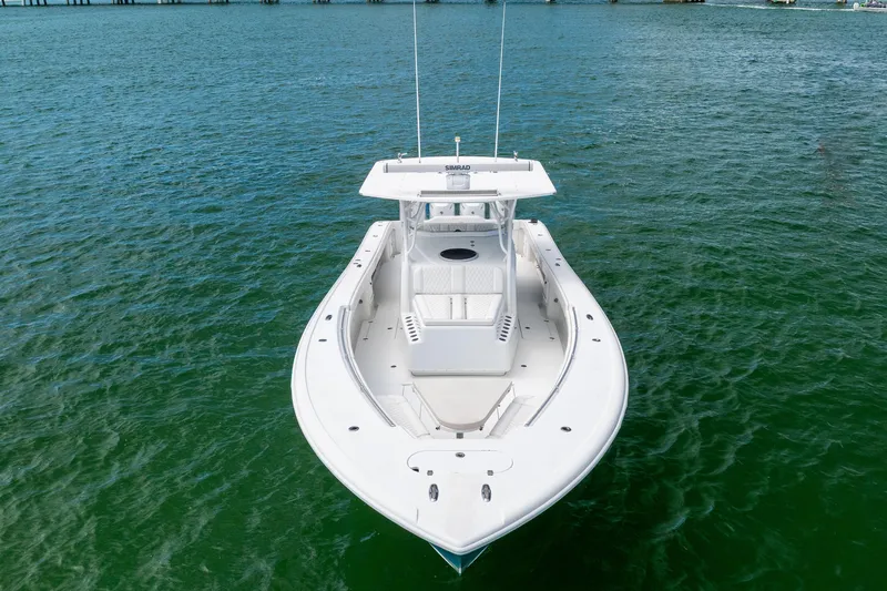  Yacht Photos Pics 2009 Yellowfin 42 Offshore boat on open water, aerial view.