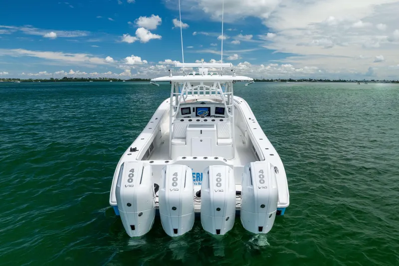  Yacht Photos Pics 2009 Yellowfin 42 Offshore boat with four powerful engines on open water.