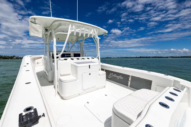  Yacht Photos Pics 2009 Yellowfin 42 Offshore boat on water, featuring spacious deck and seating.