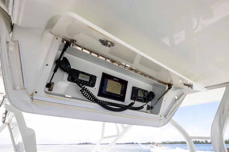  Yacht Photos Pics 2009 Yellowfin 42 Offshore boat electronics panel with communication devices and navigation screens.