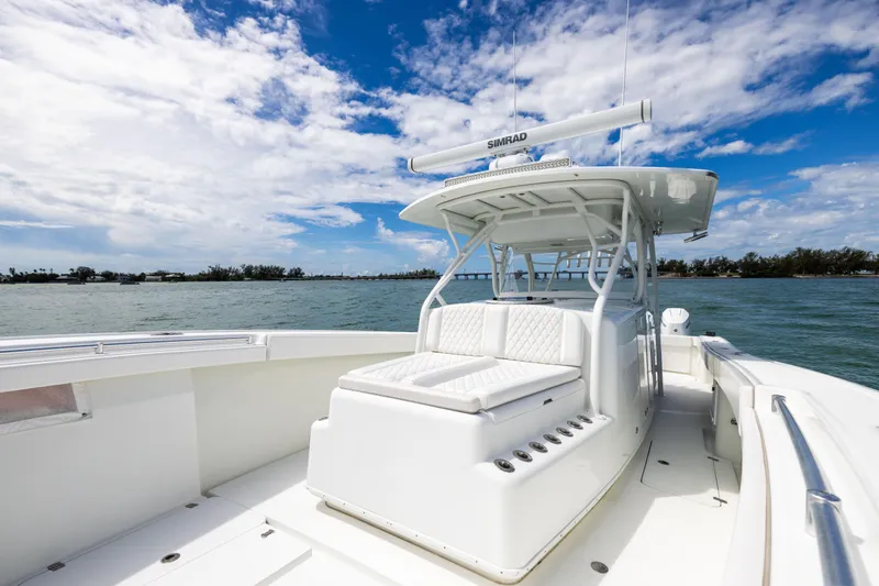  Yacht Photos Pics 2009 Yellowfin 42 Offshore boat on water under blue sky.