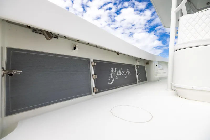  Yacht Photos Pics 2009 Yellowfin 42 Offshore boat deck with logo, under a partly cloudy sky.