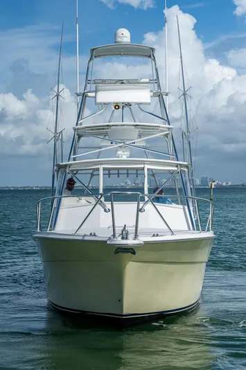  Yacht Photos Pics 2006 Topaz 32 Express boat on the water, front view.