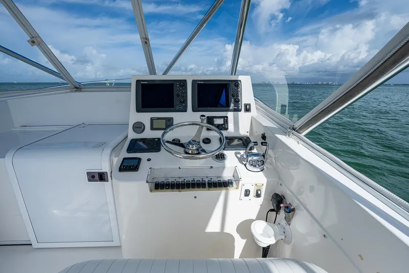  Yacht Photos Pics Helm of 2006 Topaz 32 Express boat with navigation equipment and ocean view.