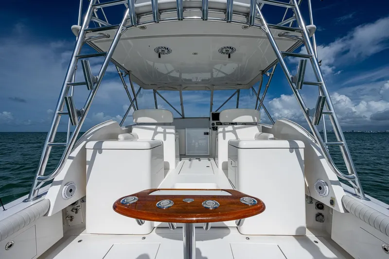  Yacht Photos Pics 2006 Topaz 32 Express boat interior with seating and table.