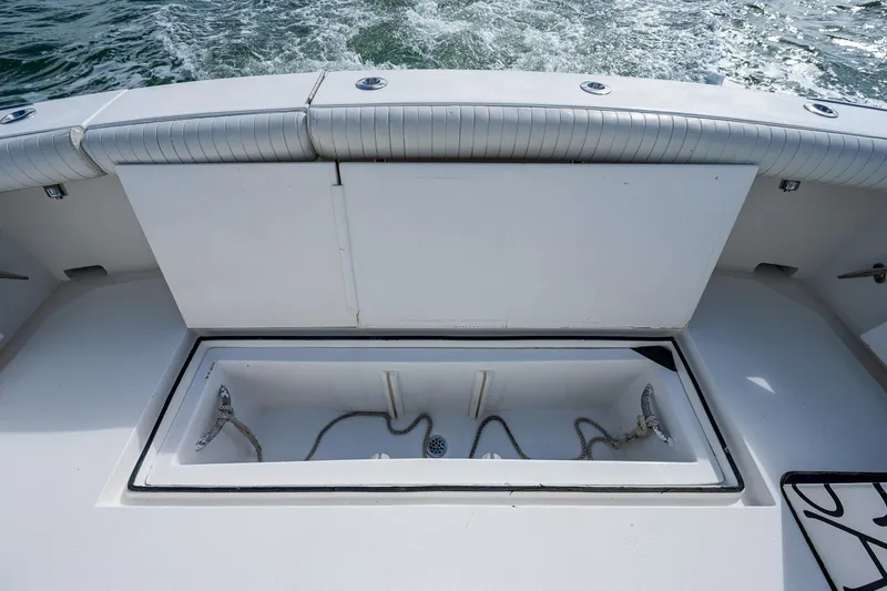  Yacht Photos Pics 2006 Topaz 32 Express boat deck with storage compartment.