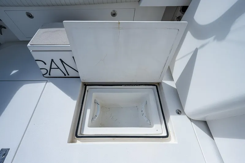  Yacht Photos Pics Open storage compartment on a 2006 Topaz 32 Express boat.