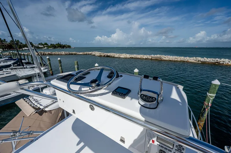  Yacht Photos Pics Helm of 2006 Topaz 32 Express boat docked at marina.