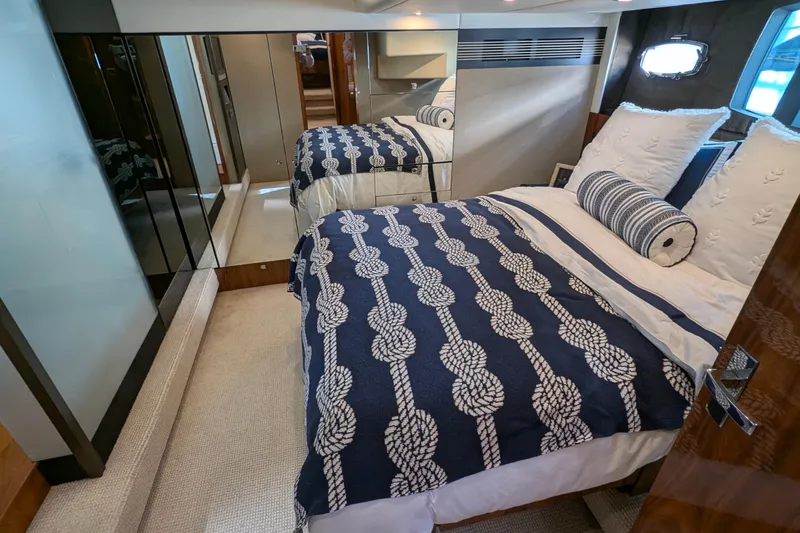 Casa Amigos Yacht Photos Pics Luxurious 2010 Fairline Squadron yacht bedroom with nautical-themed bedding and elegant decor.