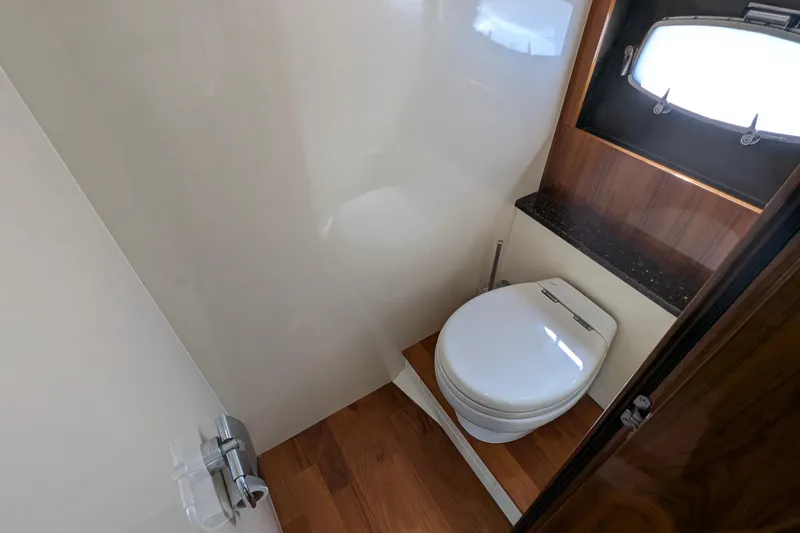 Casa Amigos Yacht Photos Pics Luxurious Fairline Squadron 2010 yacht bathroom with modern toilet and wooden accents.