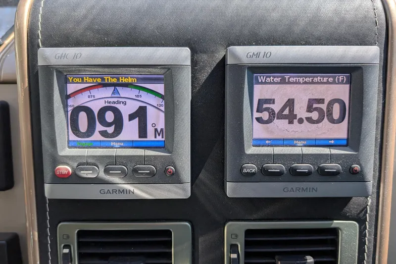 Casa Amigos Yacht Photos Pics Garmin navigation displays on 2010 Fairline Squadron showing heading and water temperature.