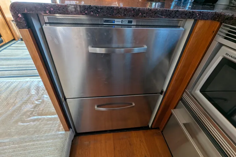 Casa Amigos Yacht Photos Pics Stainless steel dishwasher in 2010 Fairline Squadron yacht kitchen.