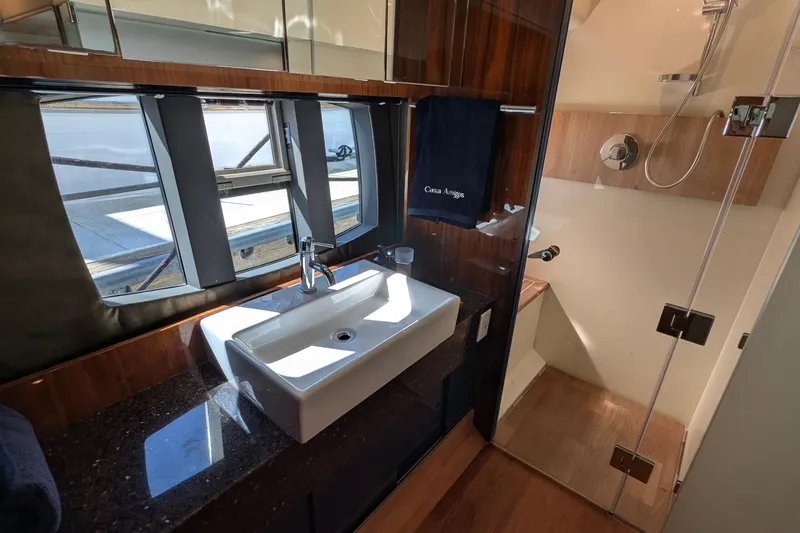 Casa Amigos Yacht Photos Pics Luxurious bathroom in 2010 Fairline Squadron yacht with modern sink and glass shower.