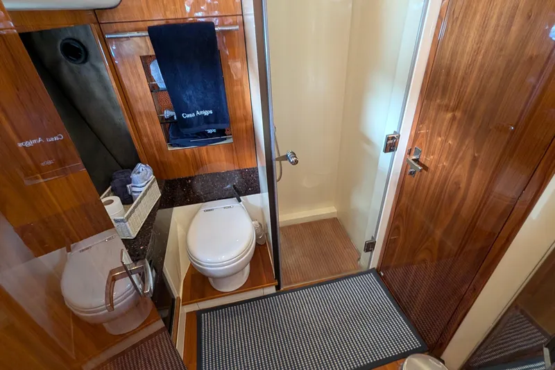 Casa Amigos Yacht Photos Pics Luxurious 2010 Fairline Squadron yacht bathroom with wood accents and modern fixtures.