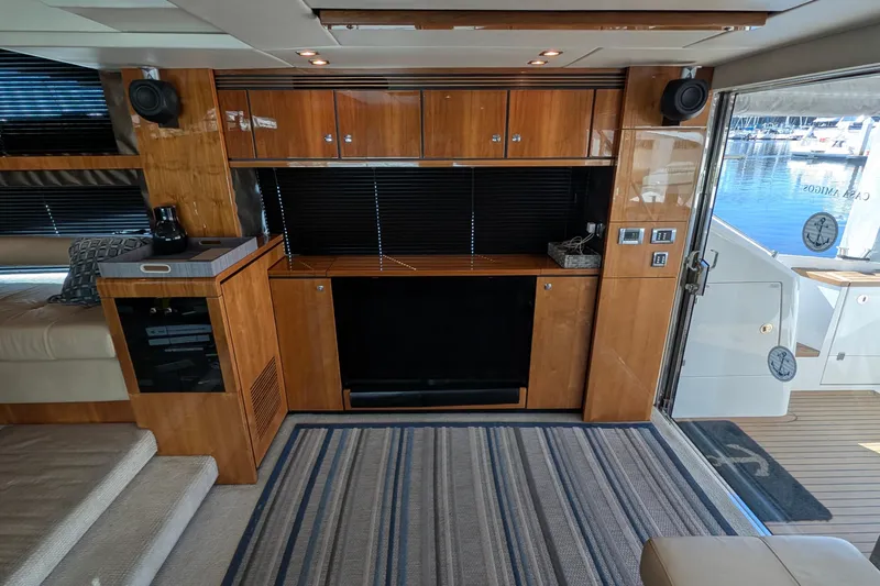 Casa Amigos Yacht Photos Pics Luxurious interior of a 2010 Fairline Squadron yacht with wood cabinetry and modern amenities.