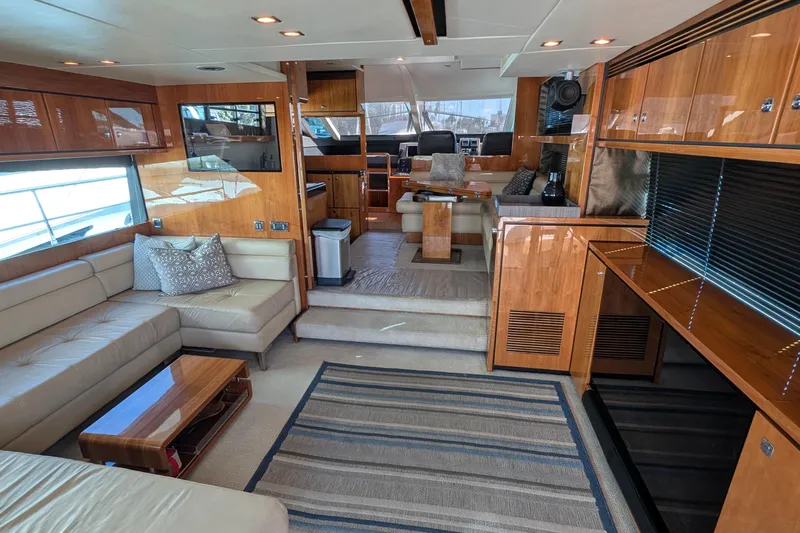 Casa Amigos Yacht Photos Pics Luxurious 2010 Fairline Squadron yacht interior with elegant wood finishes and modern furnishings.