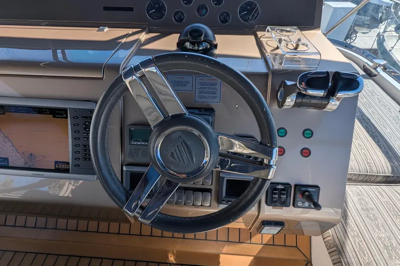 Casa Amigos Yacht Photos Pics Steering wheel and controls of a 2010 Fairline Squadron yacht.