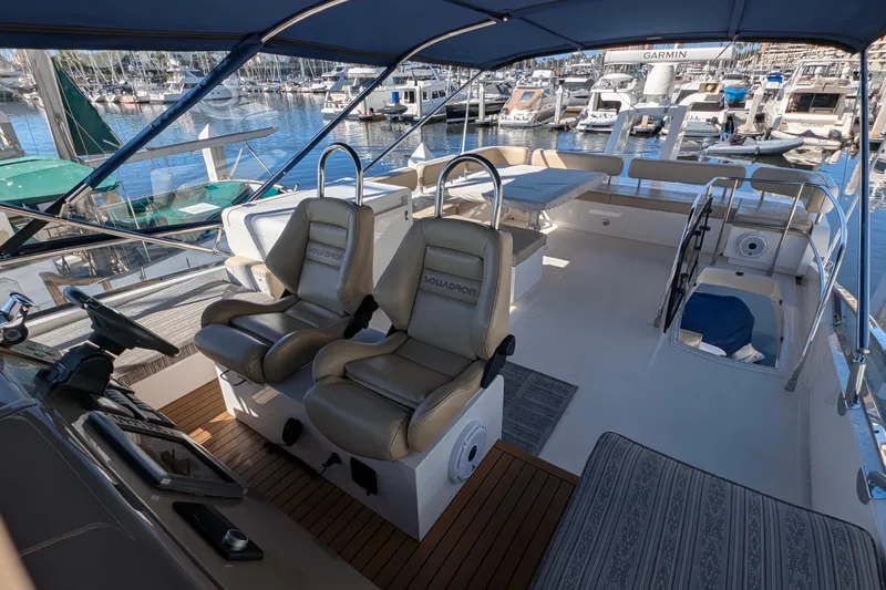 Casa Amigos Yacht Photos Pics Luxurious 2010 Fairline Squadron yacht interior with helm seats and marina view.