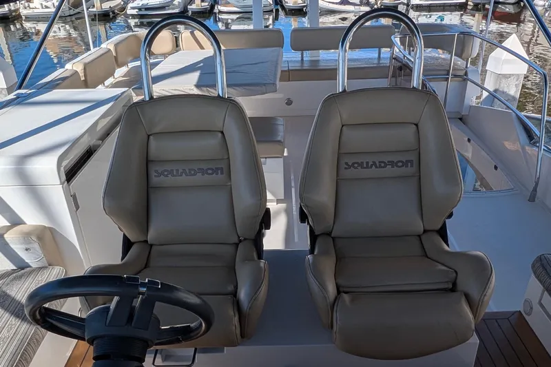 Casa Amigos Yacht Photos Pics Captain's chairs on 2010 Fairline Squadron yacht, featuring sleek design and luxurious seating.