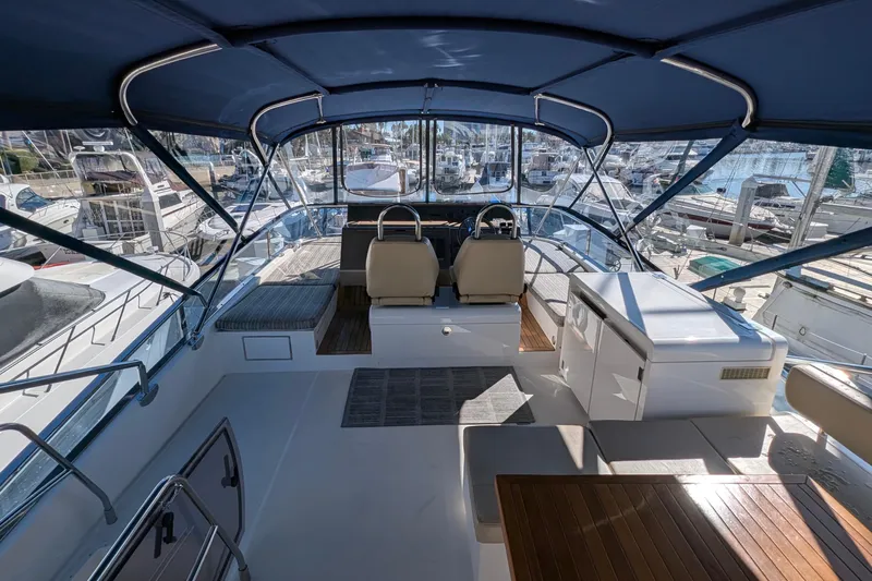 Casa Amigos Yacht Photos Pics 2010 Fairline Squadron yacht interior with helm, seating, and marina view.