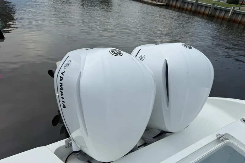  Yacht Photos Pics Twin Yamaha outboard engines on a 2015 Yellowfin 32 boat by the water.