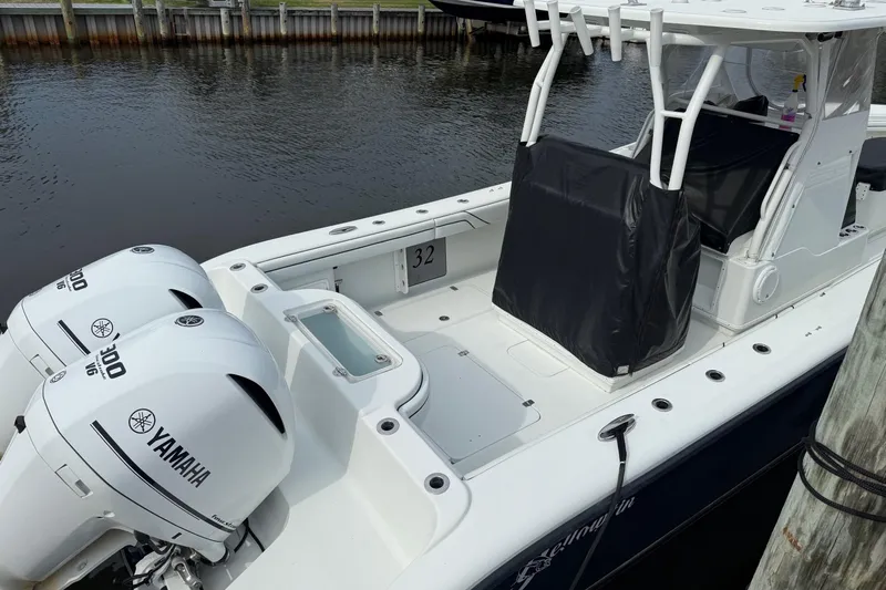  Yacht Photos Pics 2015 Yellowfin 32 boat with twin Yamaha 300 engines docked by the water.