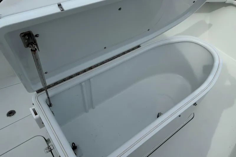  Yacht Photos Pics Open storage compartment on a 2015 Yellowfin 32 boat, showcasing interior space.