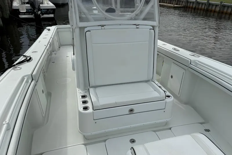  Yacht Photos Pics 2015 Yellowfin 32 boat interior with white seating and storage compartments.