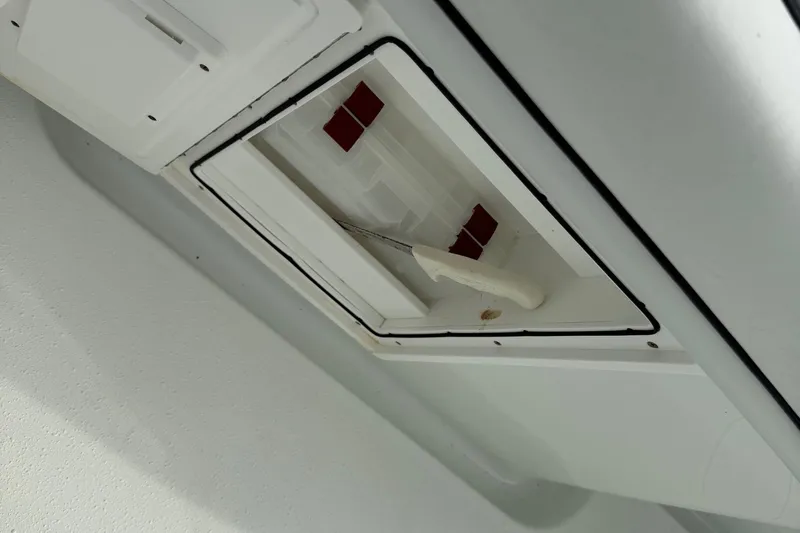  Yacht Photos Pics Ceiling compartment of 2015 Yellowfin 32 boat with open hatch and tool inside.