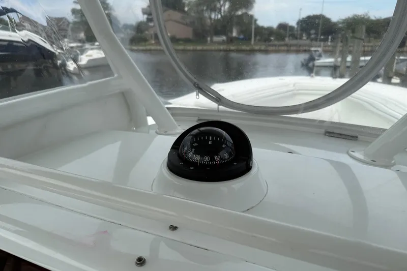  Yacht Photos Pics 2015 Yellowfin 32 boat interior with compass, docked by the water.