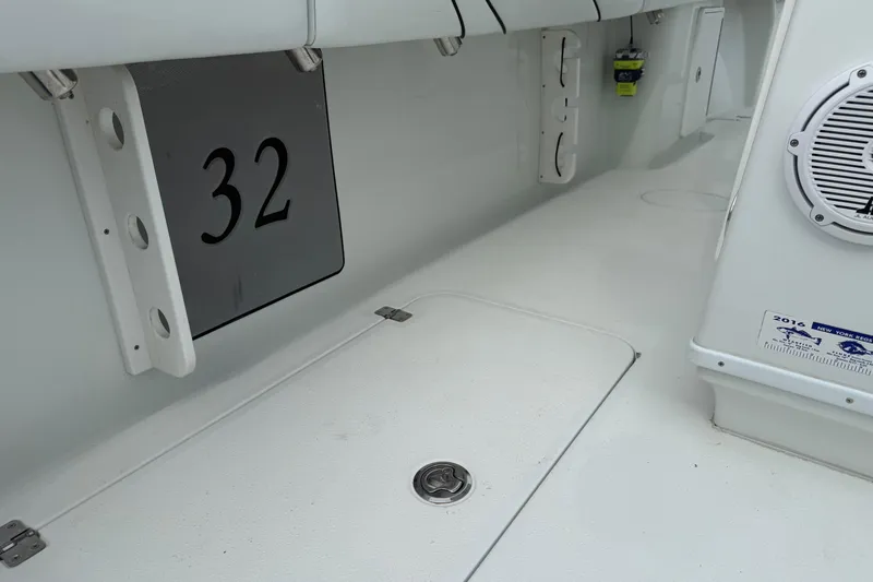  Yacht Photos Pics 2015 Yellowfin 32 boat interior with speaker and storage compartments.