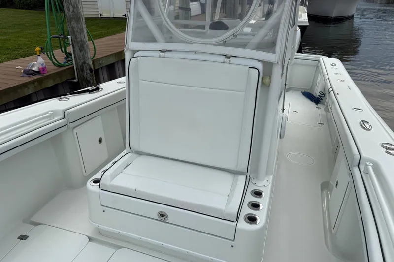  Yacht Photos Pics 2015 Yellowfin 32 boat interior with white seating and clean deck.