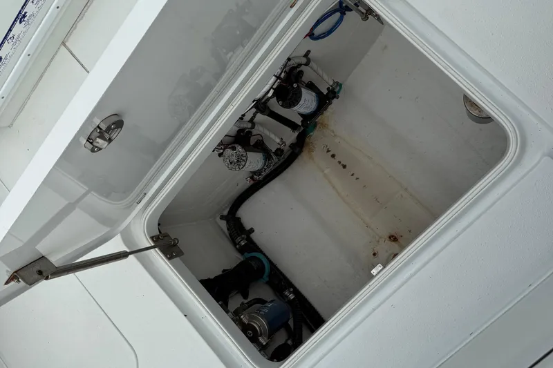  Yacht Photos Pics Open hatch of a 2015 Yellowfin 32 boat showing internal components and wiring.
