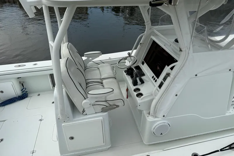  Yacht Photos Pics 2015 Yellowfin 32 boat cockpit with dual seats and steering console.