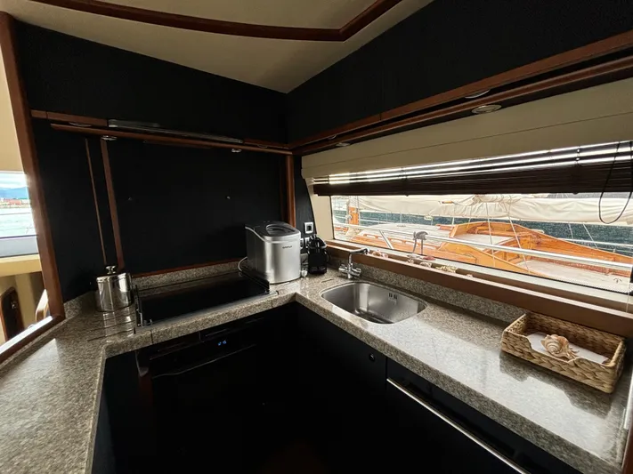  Yacht Photos Pics Luxurious kitchen interior of 2010 Princess 62 Flybridge yacht with modern appliances.