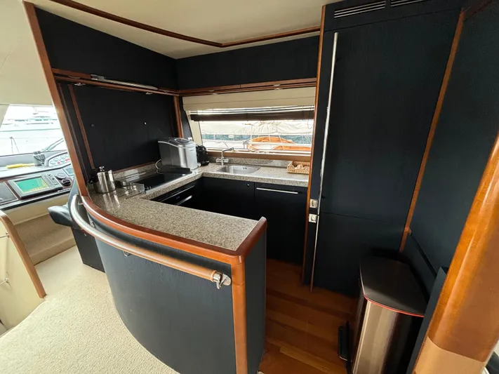  Yacht Photos Pics Interior of 2010 Princess 62 Flybridge yacht with modern kitchen and sleek design.