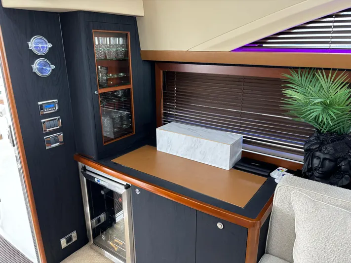  Yacht Photos Pics Luxurious interior of 2010 Princess 62 Flybridge yacht with modern cabinetry and decor.