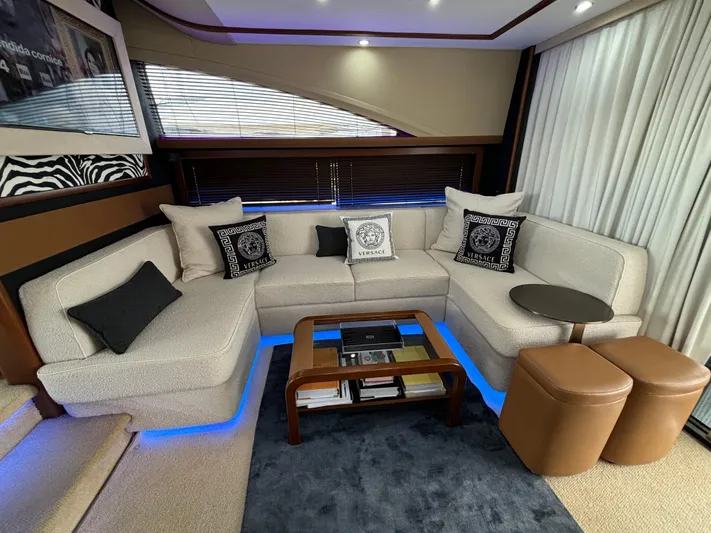  Yacht Photos Pics Luxurious interior of 2010 Princess 62 Flybridge yacht with elegant seating and ambient lighting.