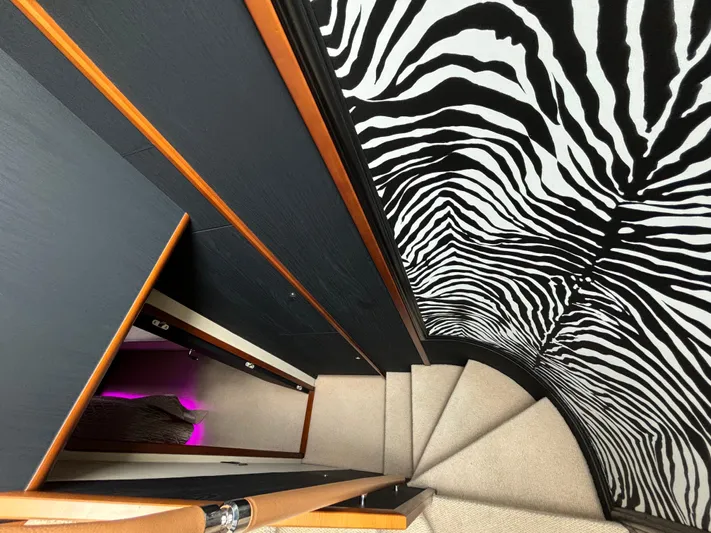  Yacht Photos Pics Staircase with zebra-patterned wall in 2010 Princess 62 Flybridge yacht interior.