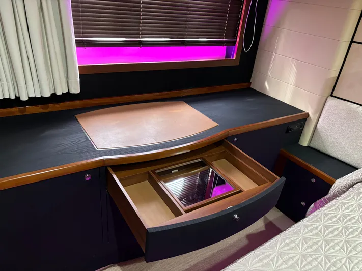  Yacht Photos Pics Luxurious cabin interior of 2010 Princess 62 Flybridge yacht with elegant drawer and window blinds.