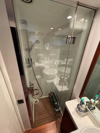  Yacht Photos Pics Luxurious bathroom in 2010 Princess 62 Flybridge yacht with glass shower enclosure.