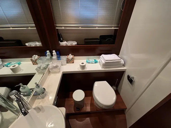  Yacht Photos Pics Luxurious bathroom in 2010 Princess 62 Flybridge yacht with modern amenities.