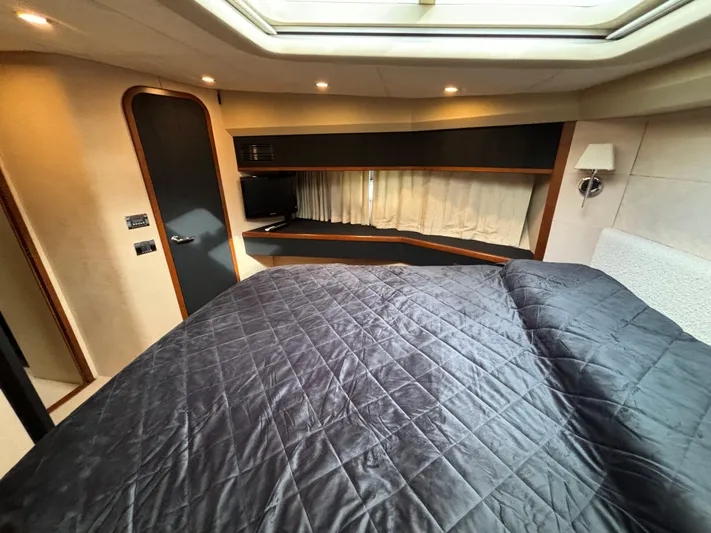  Yacht Photos Pics Luxurious cabin interior of 2010 Princess 62 Flybridge yacht with skylight and modern amenities.